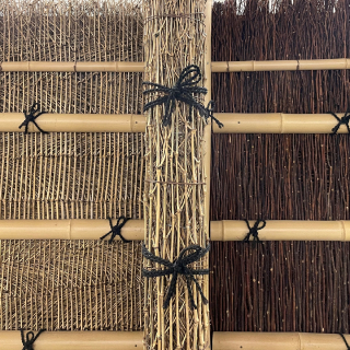 A photo of a bamboo fence.