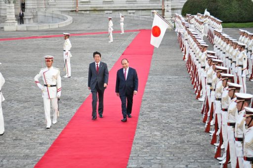 The Prime Minister Phuc of the Socialist Republic of Viet Nam and the Prime Minister Abe walking infront of the Guards of Honour lead by the commander at the Welcome Ceremony in the Front Garden