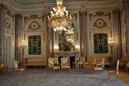 Setting for Bidding Farewell in Asahi no Ma, with the big chandelier and the golden chairs set in a horseshoe shape 