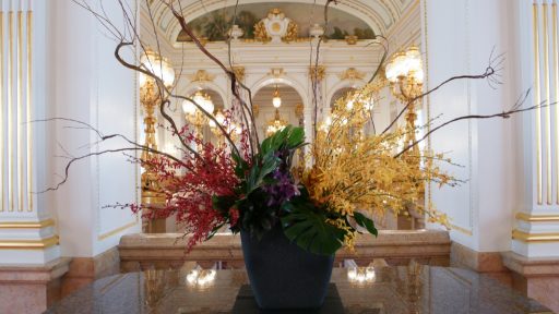 Flower arrangement of Banda Miss Joaquim, the national flower of Republic of Singapore displayed in the front of Sairan no Ma