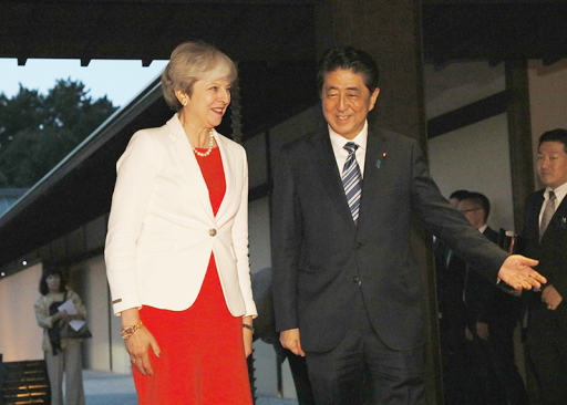 The Rt. Hon Theresa May MP, Prime Minister of the United Kingdom is escorted by Prime Minister Shinzo Abe.