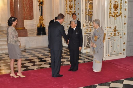 Greeting T.M the Emperor and Empress by T.R.H the Grand Duke Henri and Princess Alexandra with shaking hands in the Entrance hall