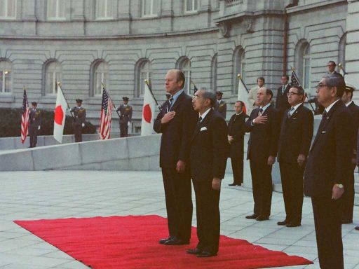 President Ford and Emperor Showa listen to national anthems during the farewell ceremony in the front garden