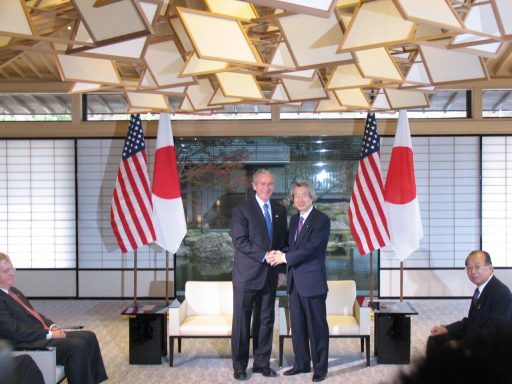 President George W. Bush and Prime Minister Junichiro Koizumi shaking hands before the summit meeting in Suimei no Ma.