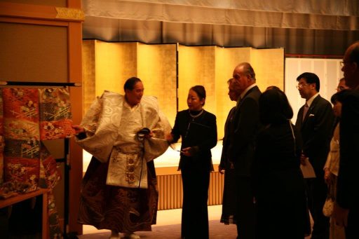 His Majesty the King Juan Carlos I of the Kingdom of Spain and Her Majesty the Queen Sofia of the Kingdom of Spain receiving the explanation of the Noh costume after the perfomance in Fuji no Ma.