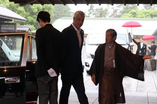 President greeted by the Director of the State Guest House.