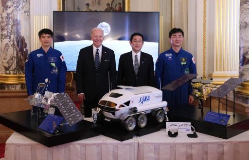 Inspection of Japan-U.S. space cooperation exibits in the large hall.