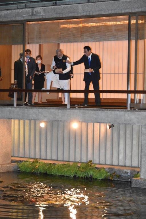 Heads of state feeding carp in Japanese-Style Annex.